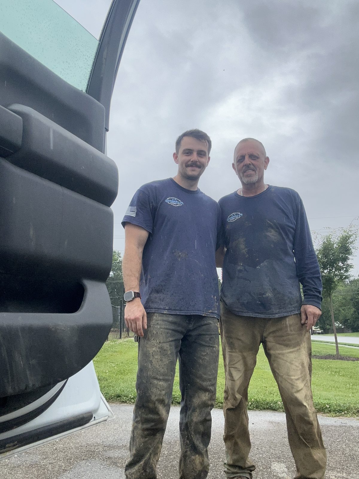 Seth and Eric mid-job on a sewer line replacement — the DE Plumbing crew at work
