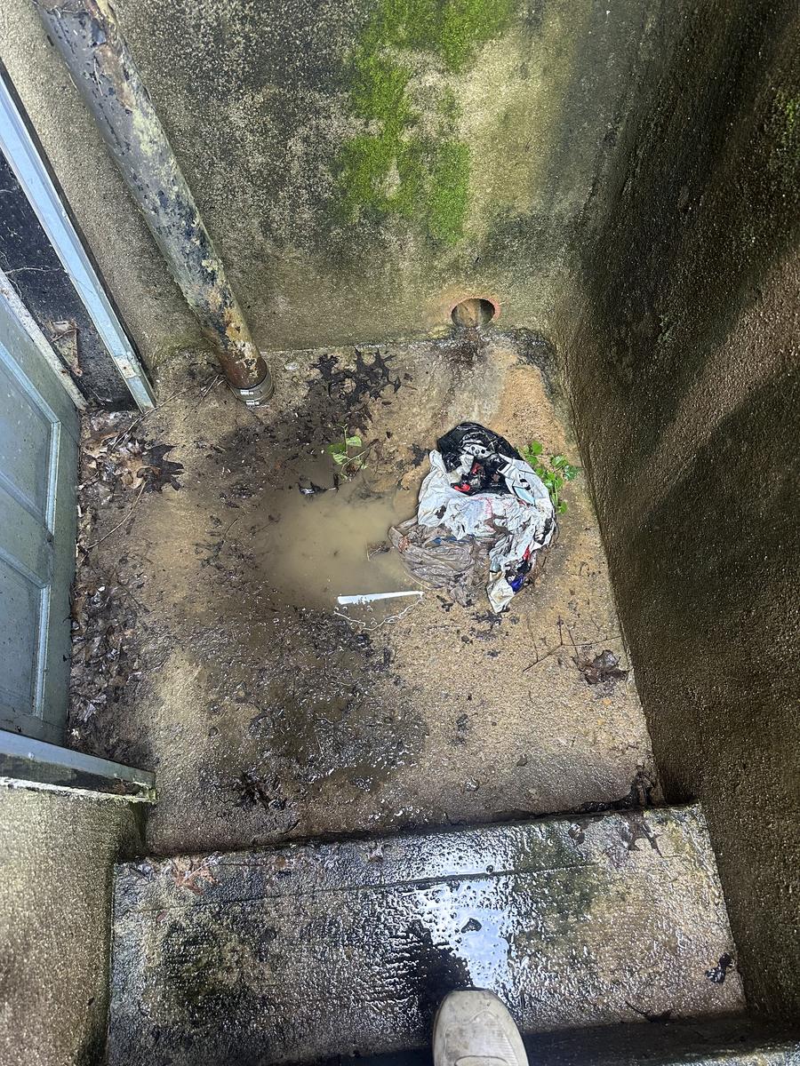 Before: badly clogged drain backing up