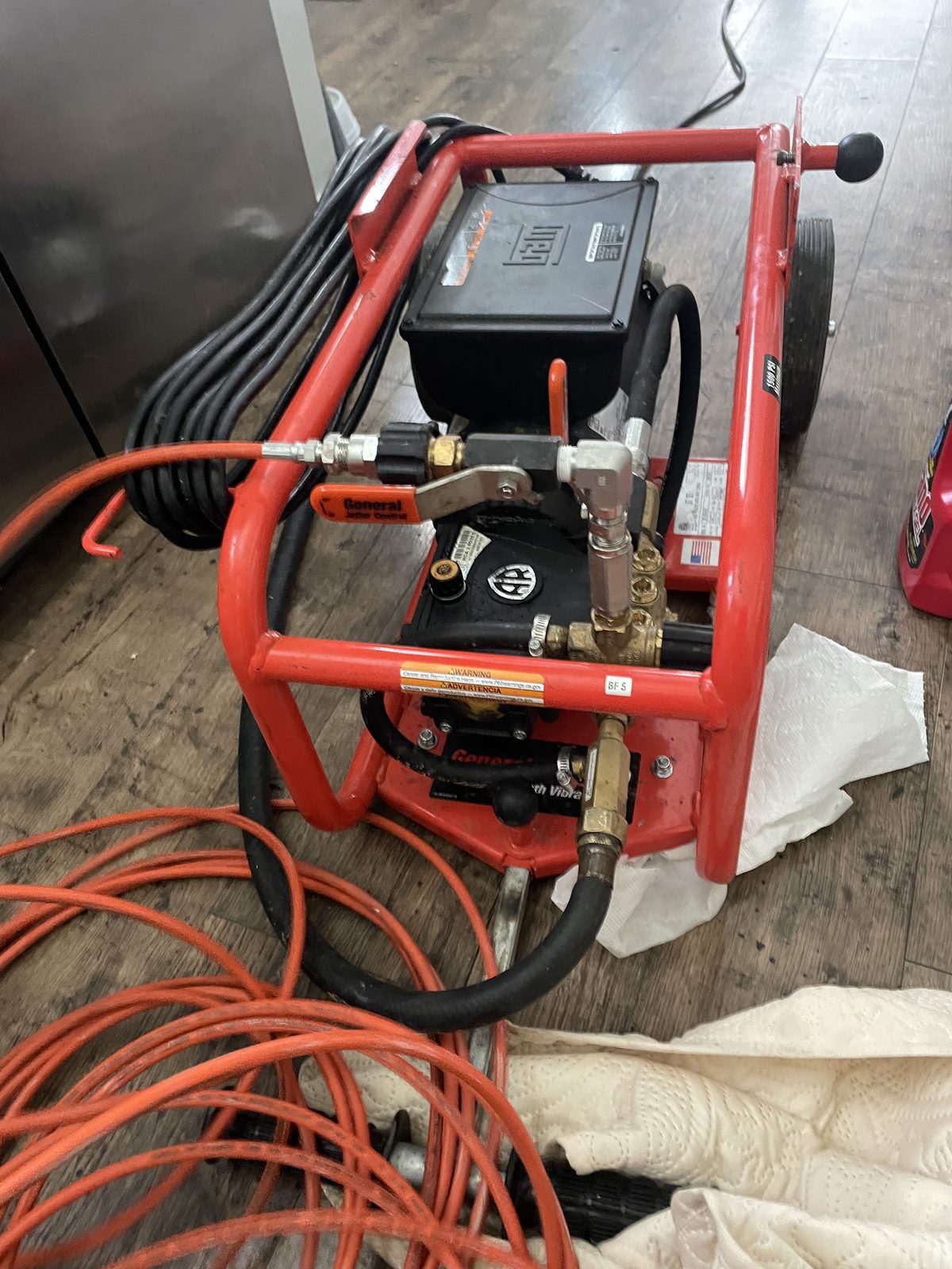 High-pressure hydro jetting equipment clearing a kitchen drain line — DE Plumbing, Cincinnati