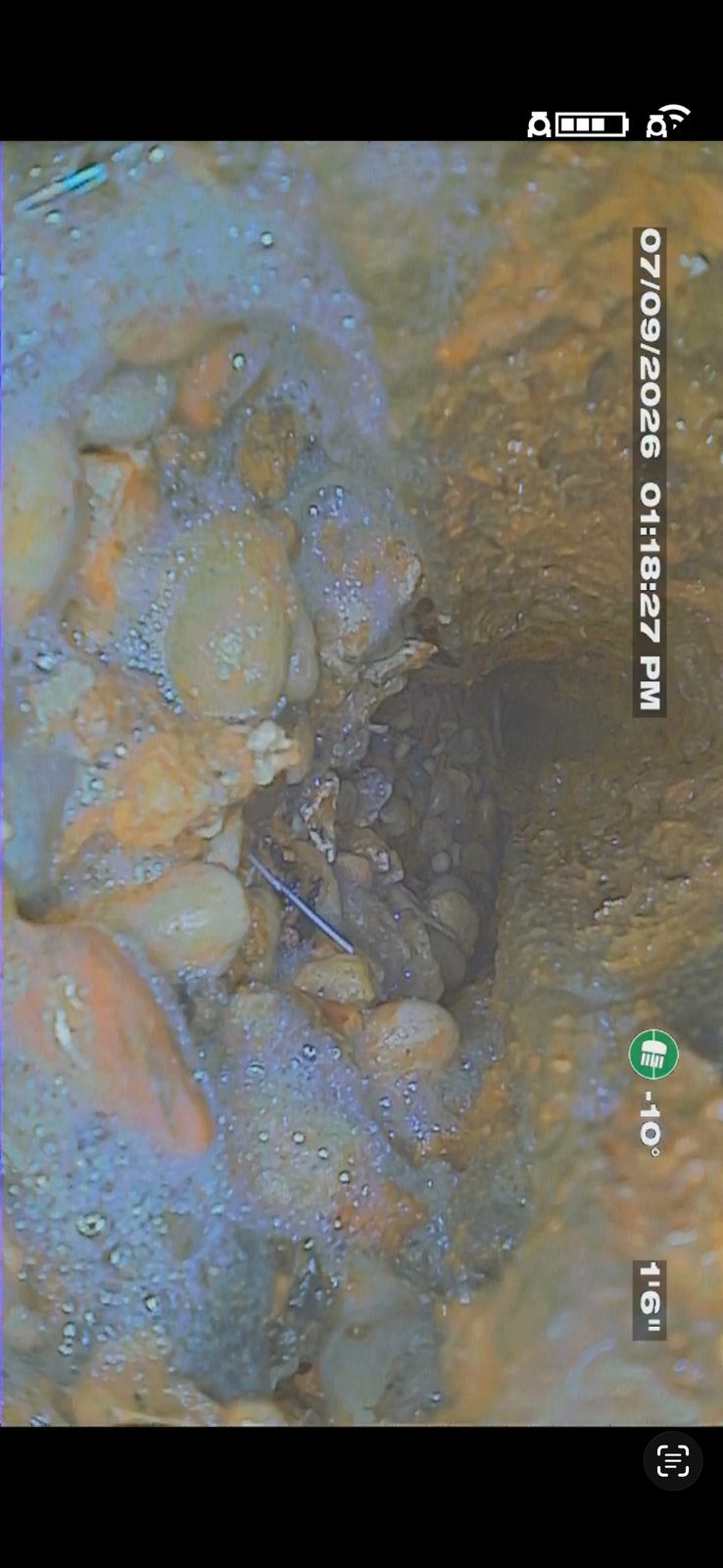 Before: sewer camera inspection still showing the line broken at the bottom