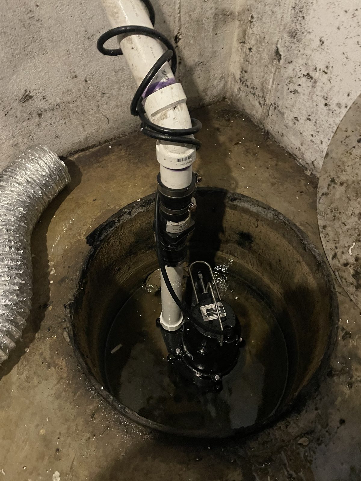 Sump pump installation in a Cincinnati basement — DE Plumbing