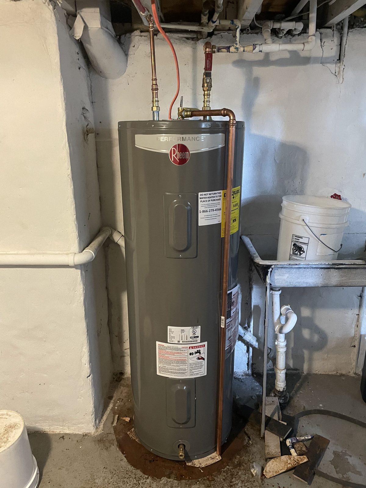 After: new water heater installed with clean connections — DE Plumbing